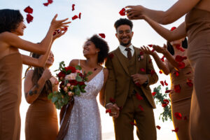 Man and woman at their wedding party, representing IV therapy package options for large wedding parties.