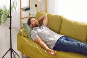 Person receiving IV therapy treatment at home