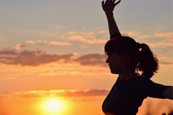 Woman in the sun, symbolizing anxiety relief through vitamin D and IV therapy.