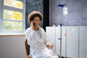 Woman receiving biotin IV therapy at home