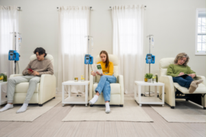 Three individuals receiving IV therapy with essential vitamins for weight loss.