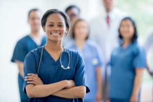 A registered nurse qualified to administer IV therapy, standing confidently.