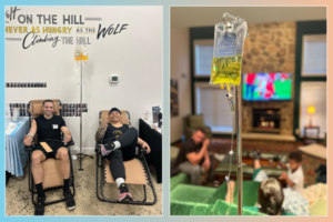 A man is in IV therapy at home, relaxing in style in his living room.