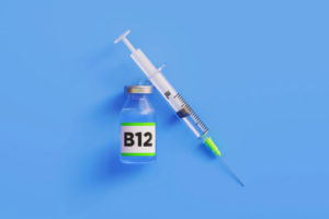 A syringe and vial labeled B12, highlighting the benefits of B12 shots over vitamins.